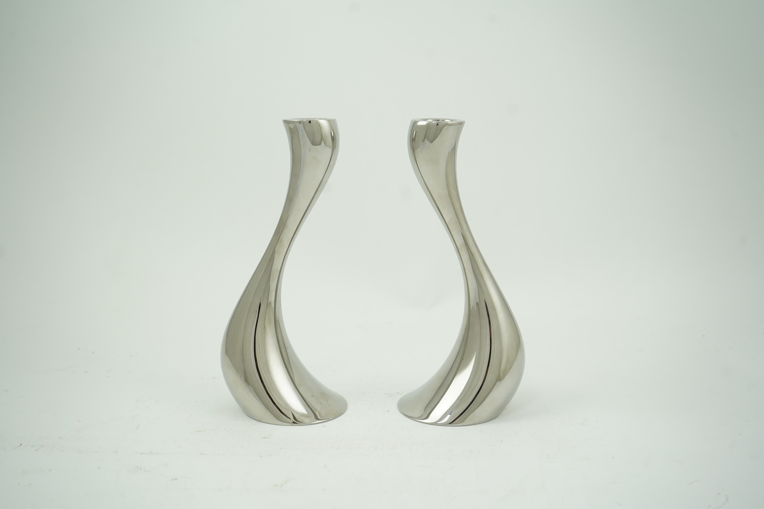 Constantin Wortmann for Georg Jensen: A pair 'of Cobra' polished steel candlesticks, marked 